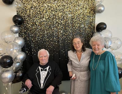 Residents celebrating at a festive party with decorations