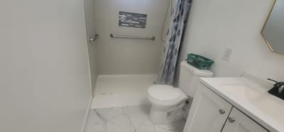 Modern bathroom with shower and amenities
