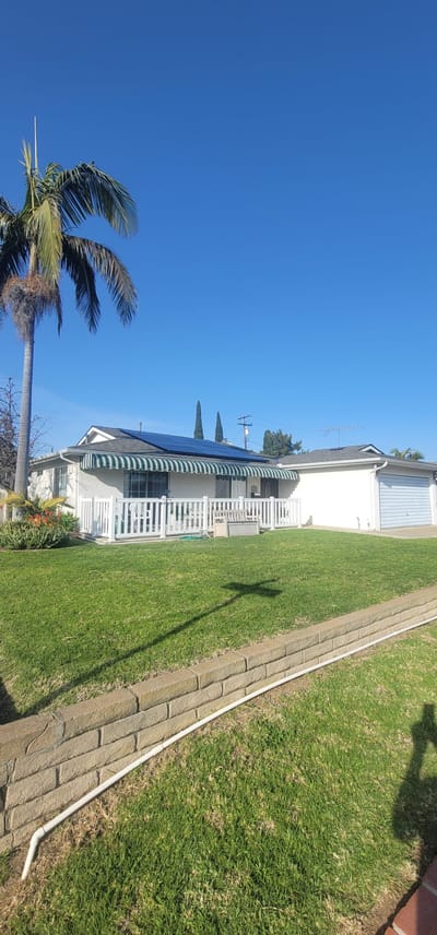 Exterior view of a residential-style facility with greenery