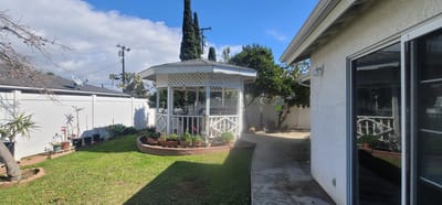 A gazebo in a landscaped outdoor area
