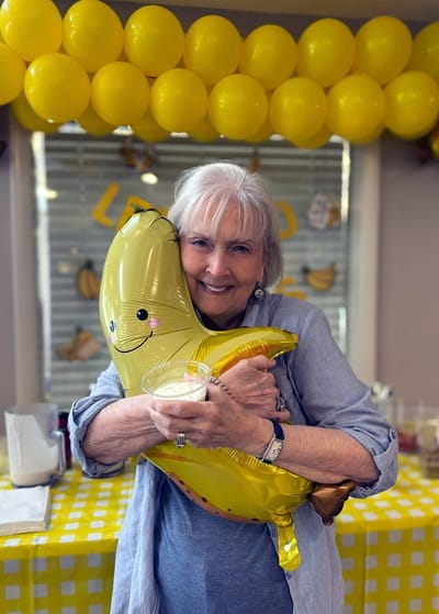 Resident celebrating with a banana-themed event and dessert