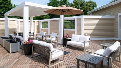 Outdoor lounge area with seating and an umbrella