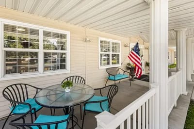 Covered outdoor seating area with American flag