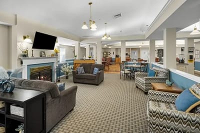 Lounge area with comfortable seating and a fireplace