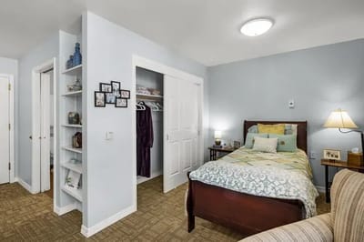 Cozy resident room with bed and personal touches