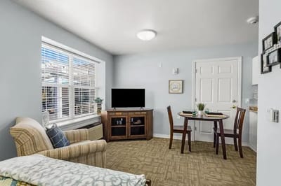 Bright interior of a resident room with a small table