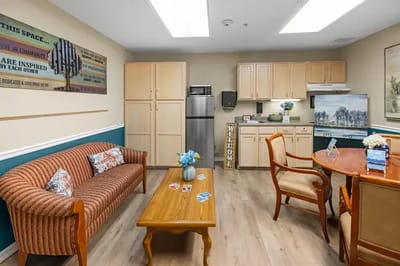 Cozy, well-lit communal living space with furniture