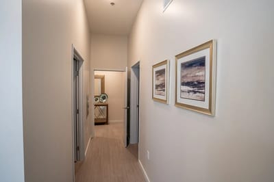 Interior hallway with framed artwork on the wall