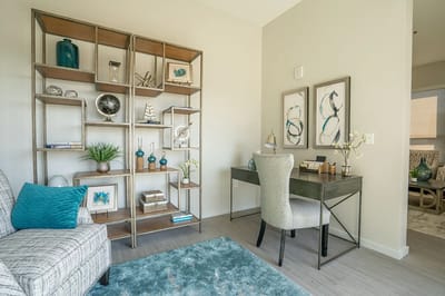A modern interior space with a desk and decorative shelving