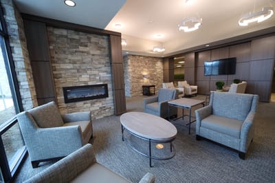 Interior common area with chairs and a fireplace