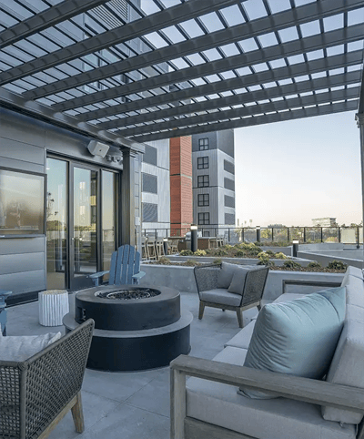 Outdoor lounge area with seating and fire pit