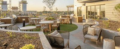 Outdoor terrace with seating and greenery
