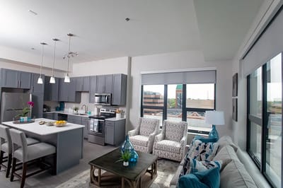 Modern kitchen and living area in a resident unit