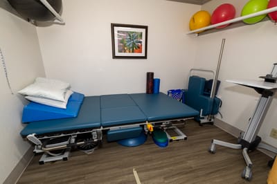 Interior view of an exercise therapy room with equipment