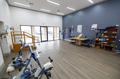Interior view of a rehabilitation room with exercise equipment