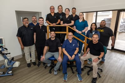 Group photo of staff in a bright common area