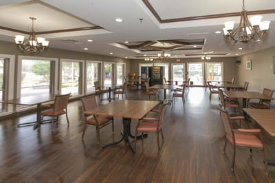 Bright dining area with wooden tables and chairs
