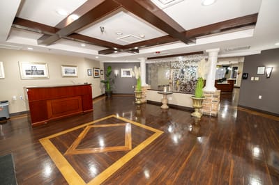 Interior lobby area with a reception desk and seating