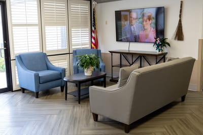 Comfortable common area with seating and a television