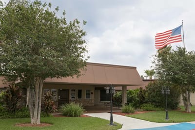 Exterior view of the facility with American flag