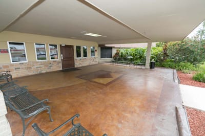 Covered outdoor seating area with benches