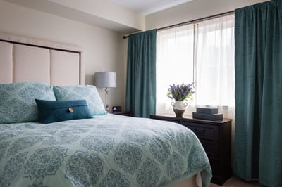 Cozy private resident room with a bed and natural light