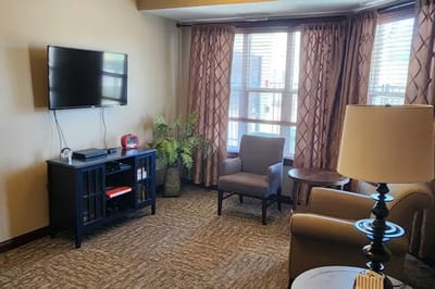 Cozy interior living area with seating and television