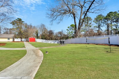 Well-kept outdoor space with pathway and garden