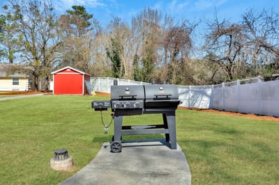 Outdoor grilling area with two barbecue grills