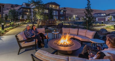 Residents enjoying an outdoor fire pit area