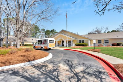 Exterior view of the facility with transport van