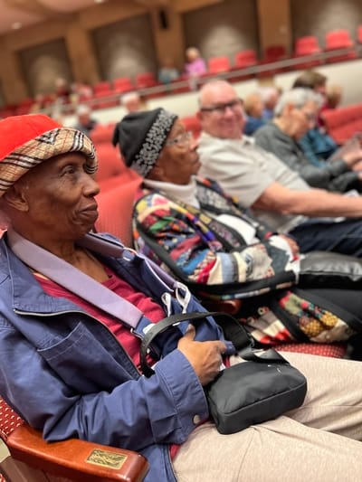Residents enjoying an event in a common area