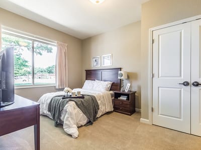 Cozy private resident room with a bed and amenities