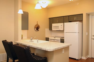 Modern kitchen in a senior living unit with appliances
