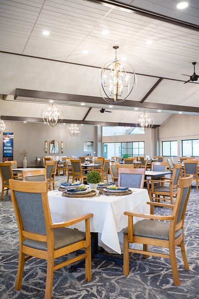Dining area with neatly set tables and modern decor