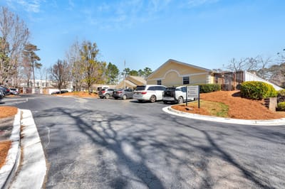 Exterior view of the facility entrance and parking area