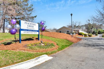 Entrance sign at Peachtree Creek Memory Care facility
