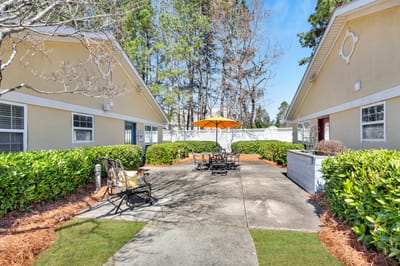 Outdoor courtyard with seating and umbrella