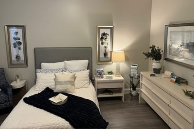 A cozy resident room with a bed and decor