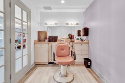 A salon area with a vintage styling chair