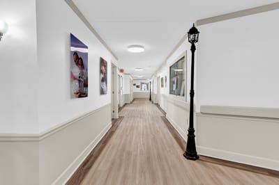 Bright corridor with artwork and lamppost