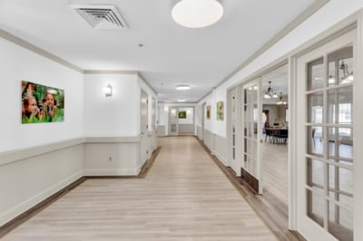 Interior hallway with photos and natural lighting