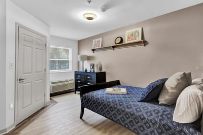 Private resident room with bed and decor
