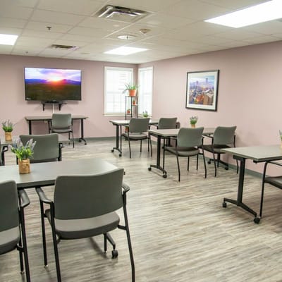 Bright common area with tables and chairs