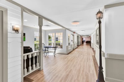 Hallway of a memory care facility with seating areas