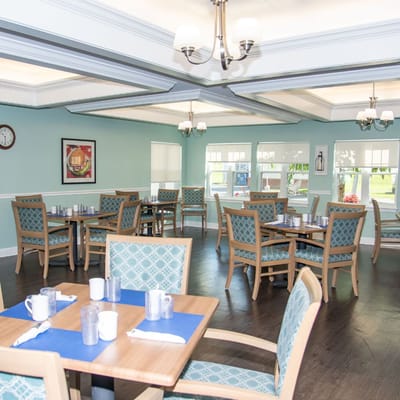 Dining room setup with tables and chairs