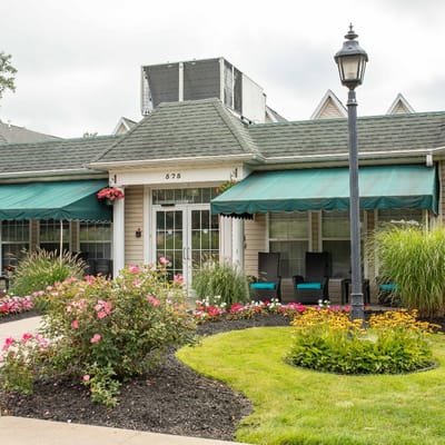 Entrance of Peregrine Senior Living at Cheektowaga with landscaped garden