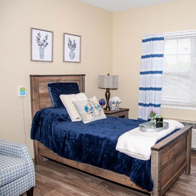 Private resident room with a bed and decor