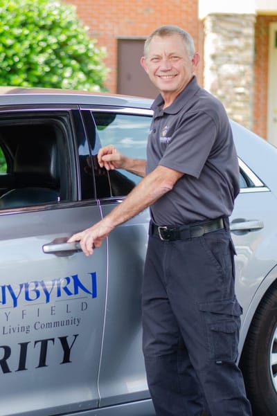 Staff member assisting with facility transport