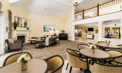 Bright common area with seating and piano